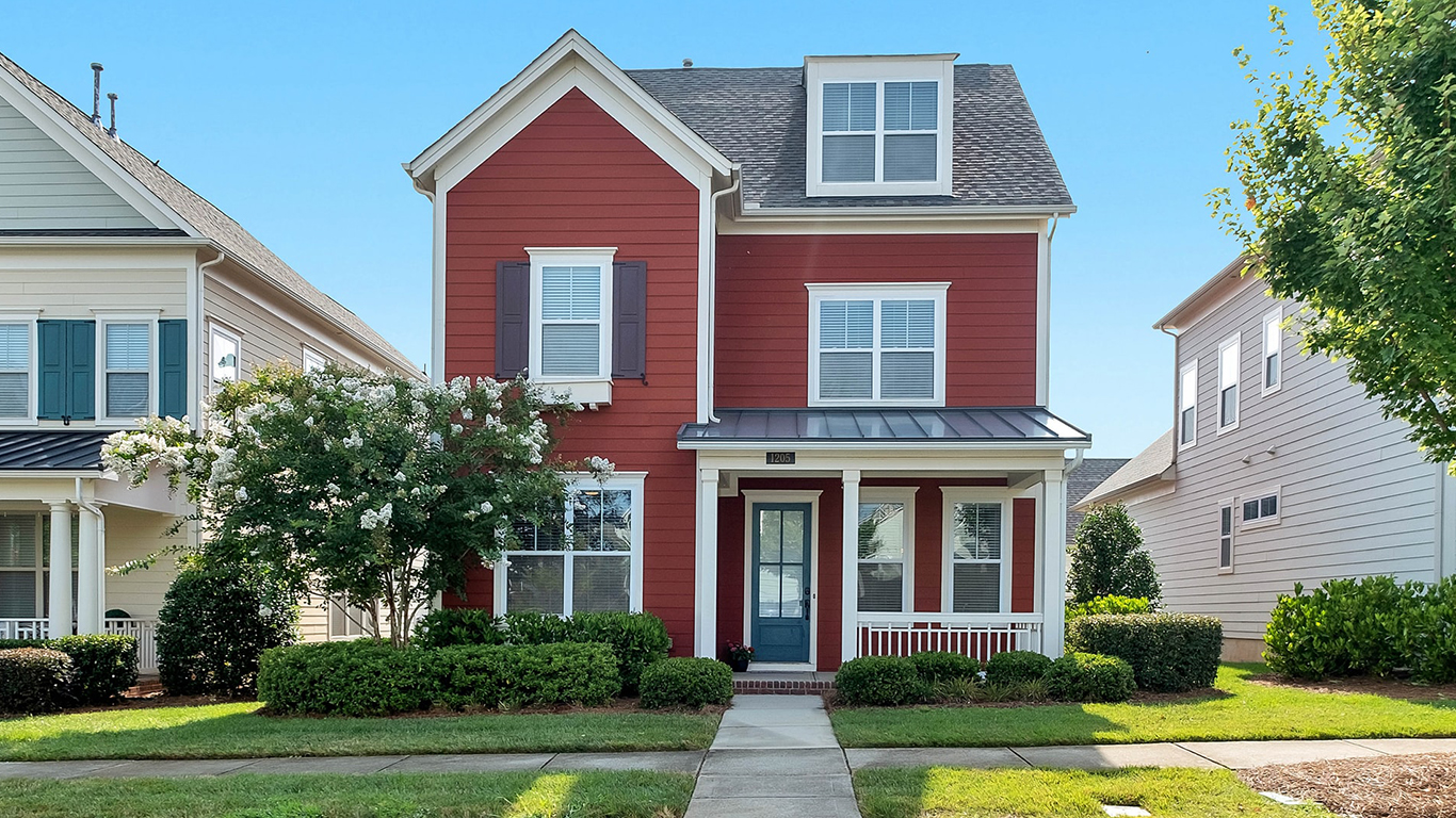 Image of a house with red, horizontal siding